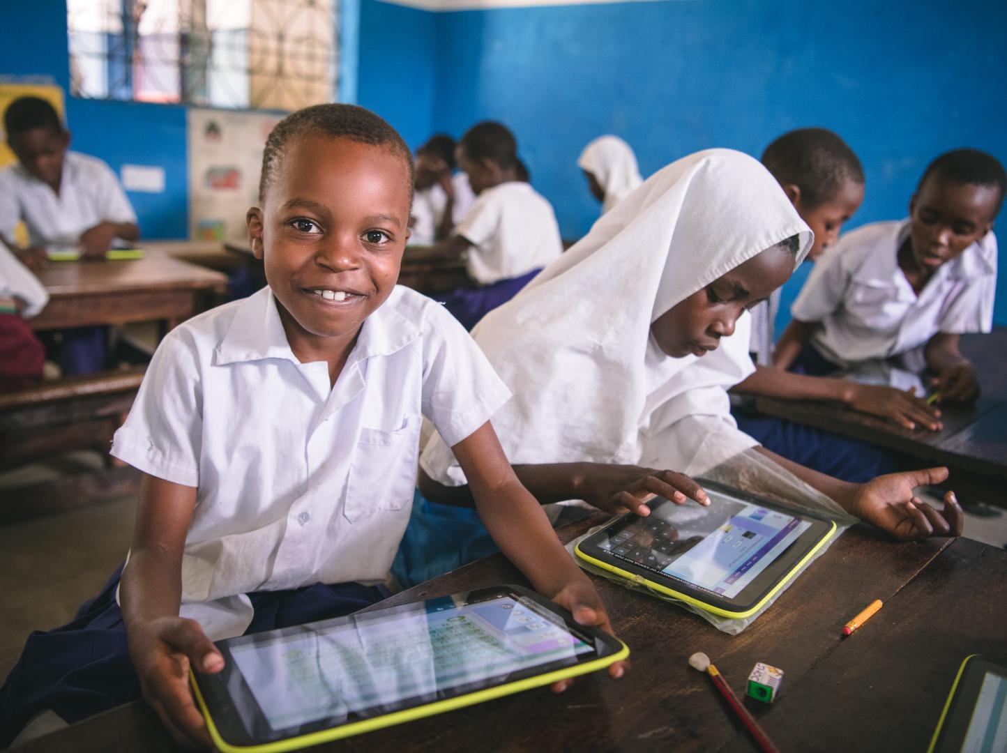 Pupil using government issued tablet in class as part of innovation in learning, Muhaka Islamic Centre Kwale Kenya. 