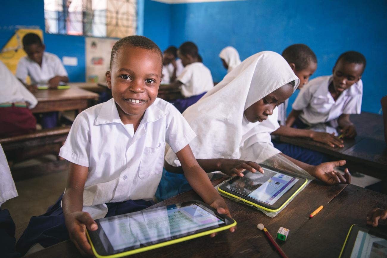 Pupil using government-issued tablet in class as part of innovation in learning, Muhaka Islamic Centre Kwale Kenya. 
