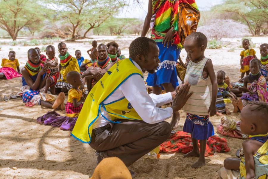 Daniel examines children from a hard-to-reach community in Lotesiro, Turkana
